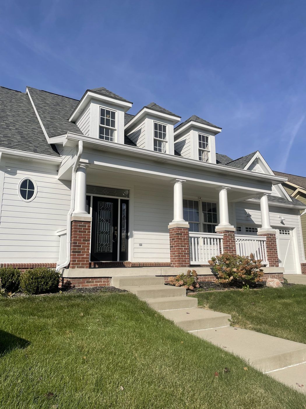 A two-story home with a covered front porch in Saxony, Fishers