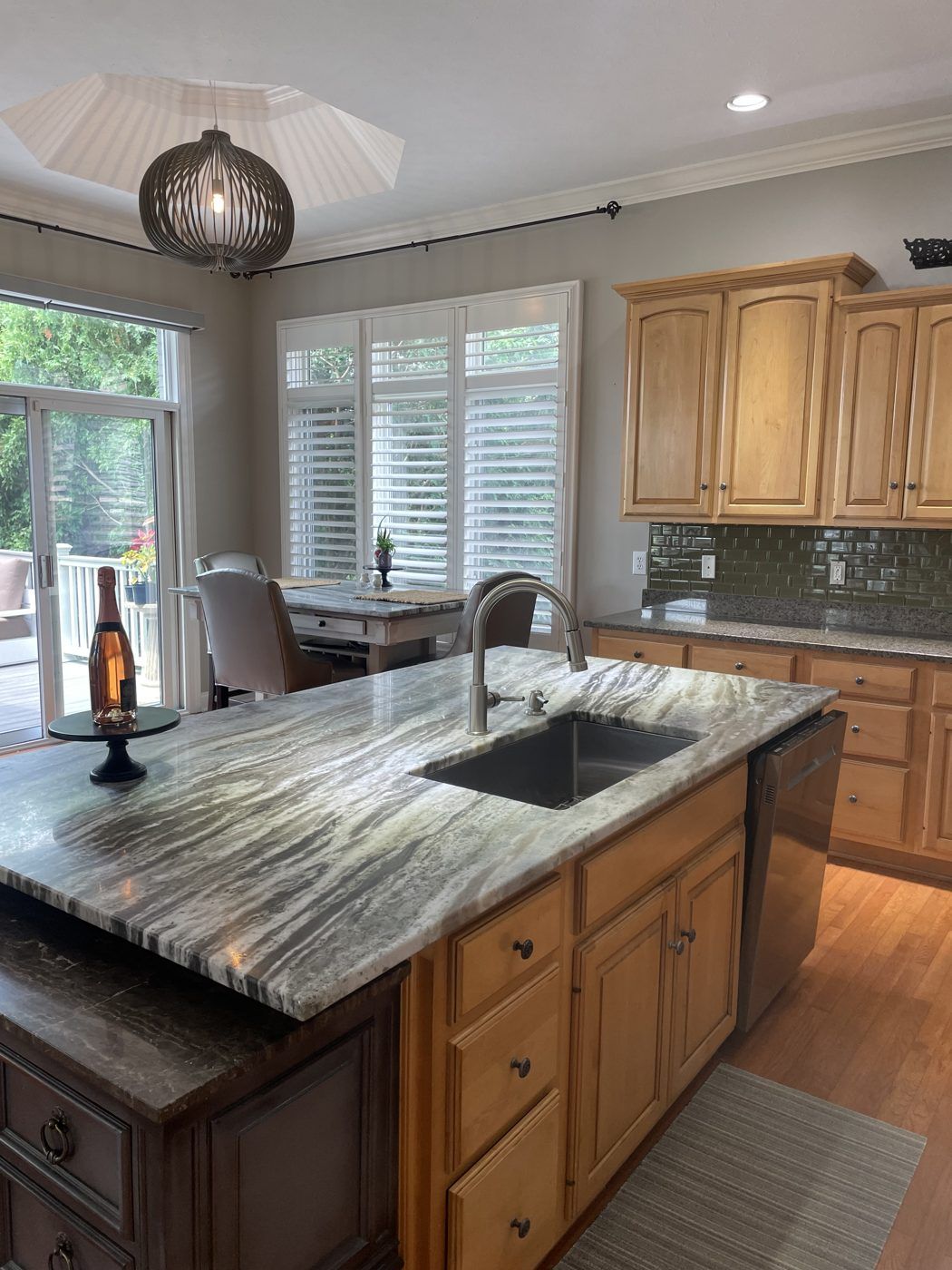 A kitchen island with a granite countertop